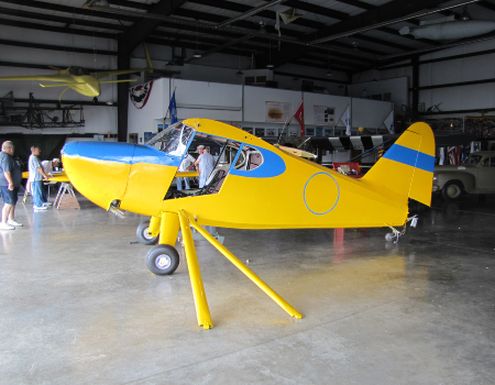 Assembling the restored Stinson 10 in the hangar