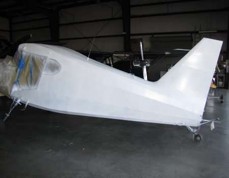 The covered Stinson fuselage ready to paint